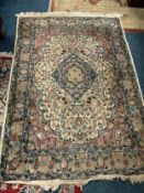 A woollen rug 180 x 128 cm