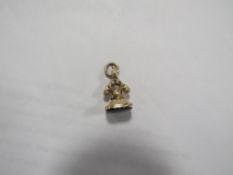 An unmarked yellow metal fob seal engraved FORGET THEE! NO!