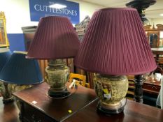 A pair of modern Chinese style porcelain table lamps with red shades