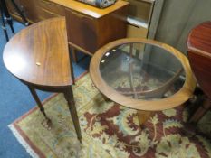 A mid century teak glass topped coffee table and a hall table