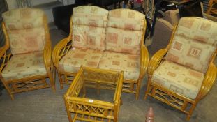 A 4 piece bamboo conservatory suite to include a 2 seater, 2 chairs and a table