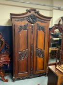 A Continental large carved armoire H 237 cm W 138 cm