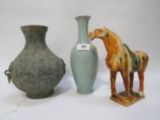 An Oriental bronze type vase, a Tang style horse - missing one ear and a celadon style vase