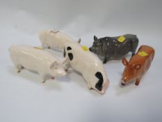 Five assorted Royal Doulton and Beswick pigs - two marked as seconds