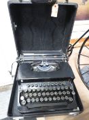 A vintage portable corona typewriter with original manual
