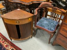 An Edwardian mahogany corner chair and a small mahogany tambour front cabinet. (2)