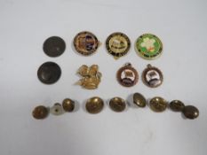 A tin of railway badges, medals and buttons