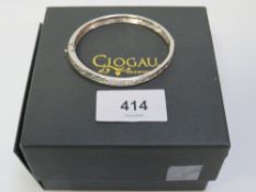 Clogau - a 925 silver bangle with Celtic design, central band half the bangle silver the other