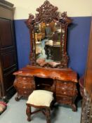 A Continental carved dressing table with mirror with stool H 218 cm W 135 cm