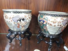 A Pair of Oriental style Jardinières on stands