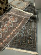 Three modern blue rugs