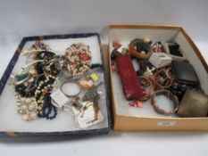 Two trays of assorted vintage costume jewellery to include a novelty hallmarked silver birth