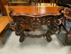 A carved mahogany console table W 134 cm