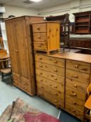 A honey pine wardrobe with a chest of drawers and bedside chest. (3)