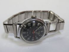 A Timex military type water resistance wristwatch on replacement stainless steel bracelet