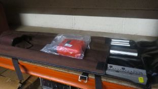 A Cowley automatic level and dumpy measure