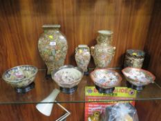 Six Oriental style vases on stands