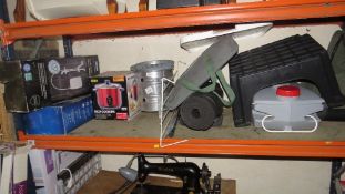 A selection of boxed items to include camping shelf, showers, slow cooker, flooring etc