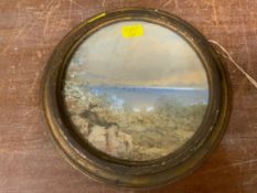 A 19th century circular watercolour mountainous lake scene with boats