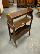 An Edwardian oak book trough/rack
