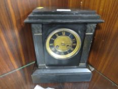 A vintage slate mantle clock