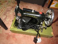 A small Italian musical table together with a vintage cased electric Singer sewing machine