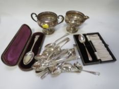 A tray of assorted silver ware to include a cream jug and sugar bowl stamped sterling with filled