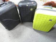 Three hard shell suitcases