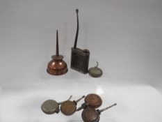 A collection of small vintage oil cans