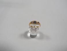 A hallmarked 18 carat gold sapphire and diamond ring approx weight 2.7g