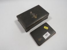 An unusual Japanese Komai box, inlaid with a yellow and white metal reme badge, marked to