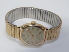 A vintage 9ct gold J W Benson wristwatch on expandable steel bracelet with engraving to back cover