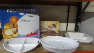 A boxed bread maker and serving dishes etc