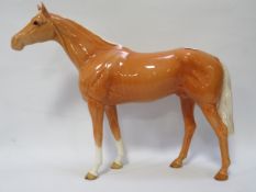 A large Beswick Palomino race horse