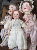 Three vintage bisque head dolls, one marked KR to nape of neck
