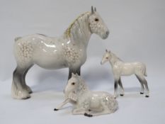 A Beswick grey shire mare together with a foal and another A/F