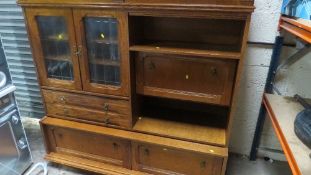 An oak finished entertainment wall unit height 164 cm width 170 cm (in 2 sections)