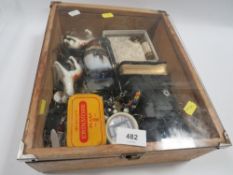 A display case of collectables to include watches, pipes etc