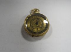 A gold 18k open faced manual wind fob watch approx weight 31.5g