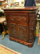 A carved mahogany drinks cabinet W 88 cm
