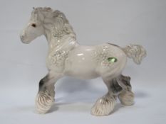 A Beswick cantering grey shire