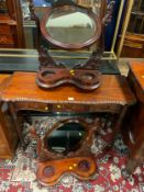 A carved mahogany console table with two dressing mirrors - one needs restoring