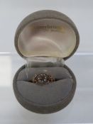 An unmarked ruby and seed pearl ring approx weight 1.7g