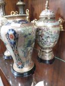 An oriental Style lidded urn on stand with a similar lidded vase