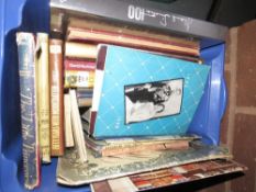 A tray of assorted board games together with a tray of vintage books