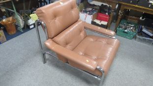 A retro Pieff chrome and leather easy chair