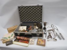 A carrycase of assorted collectables to include compasses etc