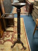 A mahogany carved and barley twist jardiniaire stand H 133 cm