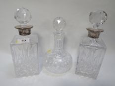 Two hallmarked silver topped decanters together with a standard decanter (3)