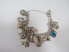 A silver charm bracelet and charms